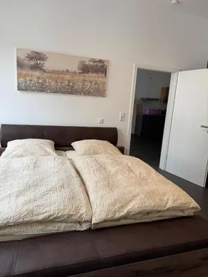 Ein Bett oder Betten in einem Zimmer der Unterkunft Ferienwohnung Alina