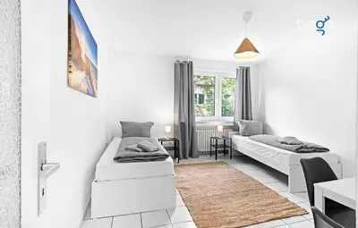 Ein Bett oder Betten in einem Zimmer der Unterkunft BEGE APARTMENTS WorkWell