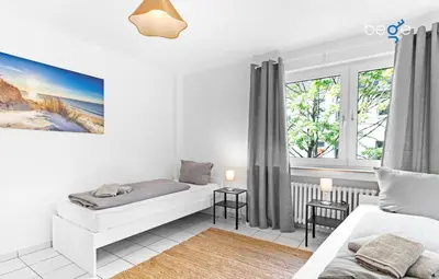 Ein Bett oder Betten in einem Zimmer der Unterkunft BEGE APARTMENTS WorkWell