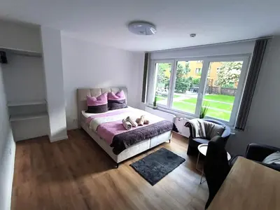 Ein Bett oder Betten in einem Zimmer der Unterkunft Deluxe Apartment mit 3 Schlafzimmern Hauptbahnhof und zentrumsnah