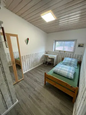 Ein Bett oder Betten in einem Zimmer der Unterkunft Kaminstube Hof Friebe