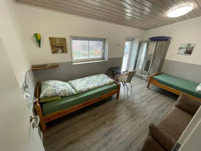 Ein Bett oder Betten in einem Zimmer der Unterkunft Kaminstube Hof Friebe