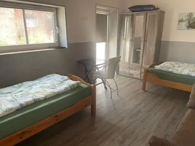 Ein Bett oder Betten in einem Zimmer der Unterkunft Kaminstube Hof Friebe
