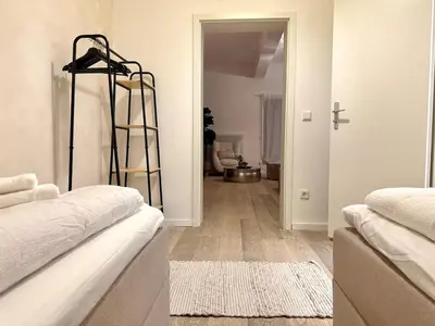 Ein Bett oder Betten in einem Zimmer der Unterkunft Loft I 3 Min bis Hbf I Netflix I Boxspring Betten