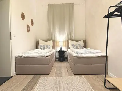 Ein Bett oder Betten in einem Zimmer der Unterkunft Loft I 3 Min bis Hbf I Netflix I Boxspring Betten
