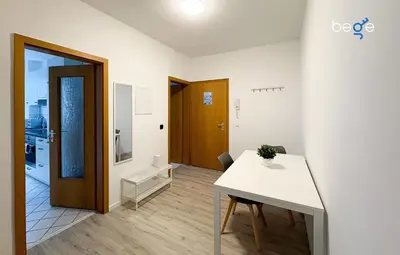 Ein Bett oder Betten in einem Zimmer der Unterkunft BEGE APARTMENTS CityApartment