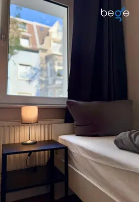 Ein Bett oder Betten in einem Zimmer der Unterkunft BEGE APARTMENTS CityApartment