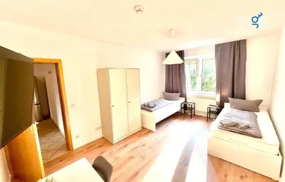 Ein Bett oder Betten in einem Zimmer der Unterkunft BEGE APARTMENTS CityApartment