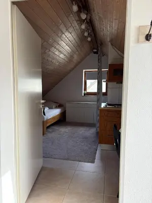 Ein Bett oder Betten in einem Zimmer der Unterkunft Cozy Apartment