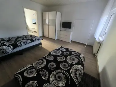Ein Bett oder Betten in einem Zimmer der Unterkunft Mego Unterkünfte 1