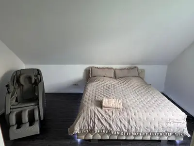 Ein Bett oder Betten in einem Zimmer der Unterkunft Ferienhaus am Rhein mit Whirlpool und Sauna