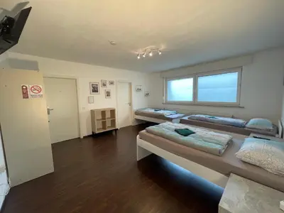 Ein Bett oder Betten in einem Zimmer der Unterkunft Moderne Monteurzimmer Vu