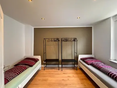 Ein Bett oder Betten in einem Zimmer der Unterkunft Rheinberg Alstadt Maisonettenwohnung