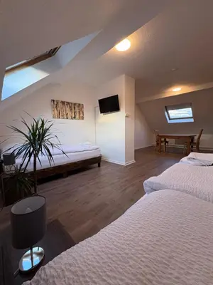Ein Bett oder Betten in einem Zimmer der Unterkunft Ferienwohnung Victoria