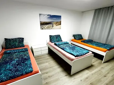 Ein Bett oder Betten in einem Zimmer der Unterkunft Modern Apartment with Balcony in Duisburg