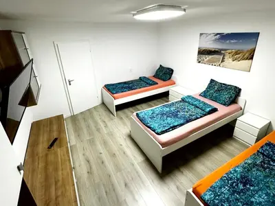 Ein Bett oder Betten in einem Zimmer der Unterkunft Modern Apartment with Balcony in Duisburg