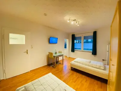 Ein Bett oder Betten in einem Zimmer der Unterkunft SASI HOMES - WorkBase