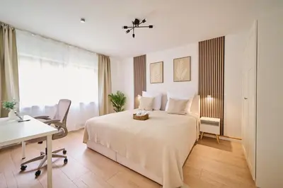 Ein Bett oder Betten in einem Zimmer der Unterkunft Goodliving Apartment City Residenz