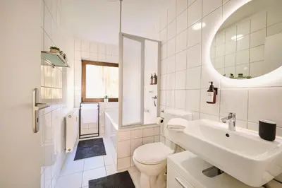 Ein Badezimmer in der Unterkunft Goodliving Apartment City Residenz