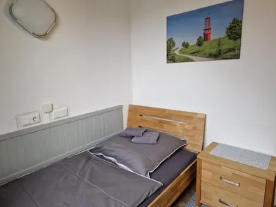 Ein Bett oder Betten in einem Zimmer der Unterkunft Pension Moers am Geleucht