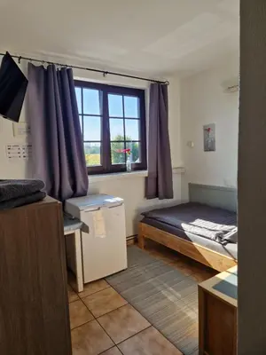 Ein Bett oder Betten in einem Zimmer der Unterkunft Pension Moers am Geleucht