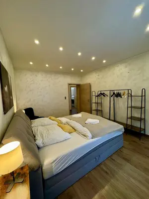 Ein Bett oder Betten in einem Zimmer der Unterkunft Apartement Rustica - MODERN NEST APARTEMENTS