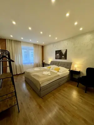 Ein Bett oder Betten in einem Zimmer der Unterkunft Apartement Rustica - MODERN NEST APARTEMENTS