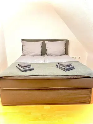 Ein Bett oder Betten in einem Zimmer der Unterkunft Moderne Unterkunft mit Parkplatz & Smart-Tv