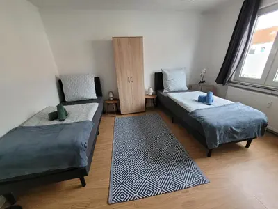 Ein Bett oder Betten in einem Zimmer der Unterkunft Nähe Dortmund, geräumige Unterkunft in Castrop-Rauxel mit top Verkehrsanbindung