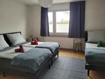 Ein Bett oder Betten in einem Zimmer der Unterkunft Nähe Dortmund, geräumige Unterkunft in Castrop-Rauxel mit top Verkehrsanbindung