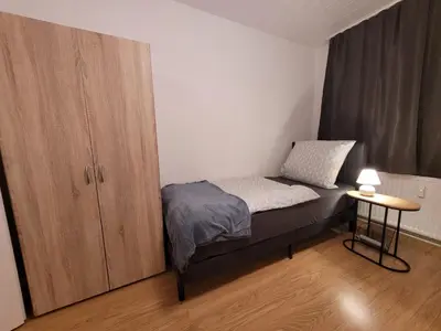 Ein Bett oder Betten in einem Zimmer der Unterkunft Nähe Dortmund, geräumige Unterkunft in Castrop-Rauxel mit top Verkehrsanbindung
