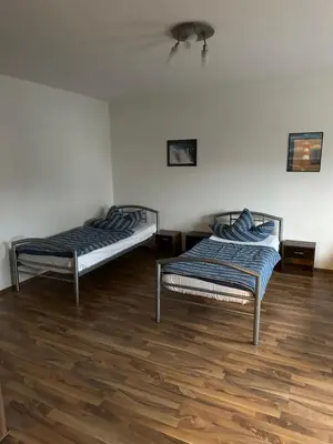 Ein Bett oder Betten in einem Zimmer der Unterkunft Helle Wohnung für 8 Personen mit 4 Schlafzimmern