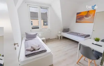 Ein Bett oder Betten in einem Zimmer der Unterkunft BEGE APARTMENTS CrewLodge