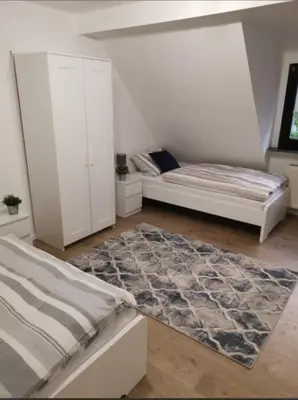 Ein Bett oder Betten in einem Zimmer der Unterkunft R&A Monteurzimmer
