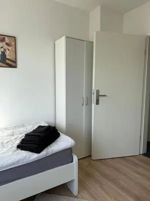 Ein Bett oder Betten in einem Zimmer der Unterkunft Monteurwohnung mit Balkon und Parkplatz