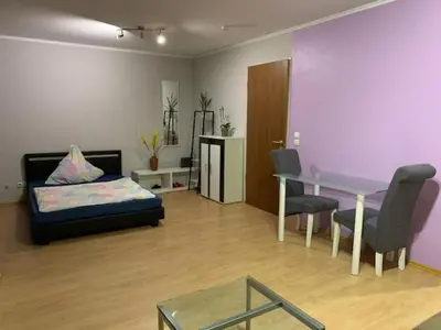 Ein Bett oder Betten in einem Zimmer der Unterkunft Düssel-Oase