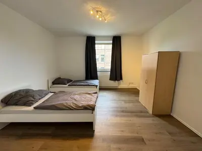 Ein Bett oder Betten in einem Zimmer der Unterkunft Cheap apartment in Solingen near Wuppertal