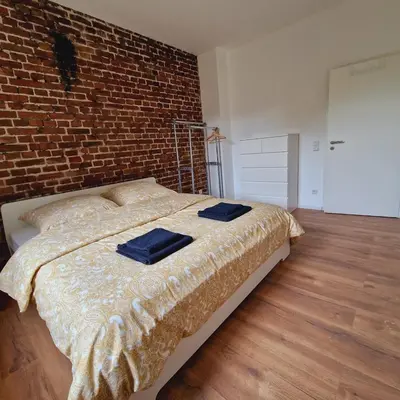 Ein Bett oder Betten in einem Zimmer der Unterkunft Heart of Essen