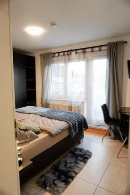 Ein Bett oder Betten in einem Zimmer der Unterkunft M House Do City Privatzimmer mit Balkon & Self Check-in