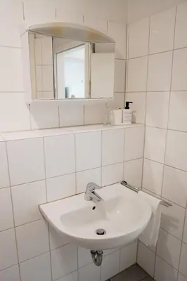 Ein Badezimmer in der Unterkunft M House Do City Privatzimmer mit Balkon & Self Check-in