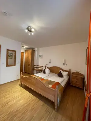 Ein Bett oder Betten in einem Zimmer der Unterkunft Landhaus Sassenhof