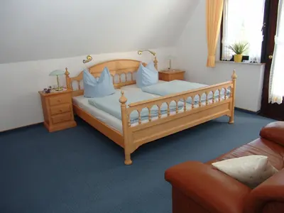 Ein Bett oder Betten in einem Zimmer der Unterkunft Landhaus Sassenhof