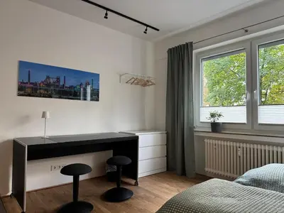 Ein Bett oder Betten in einem Zimmer der Unterkunft NOOQA Duisburg - Living Collection - Parkplatz, Smart TV, Küche, voll ausgestattet