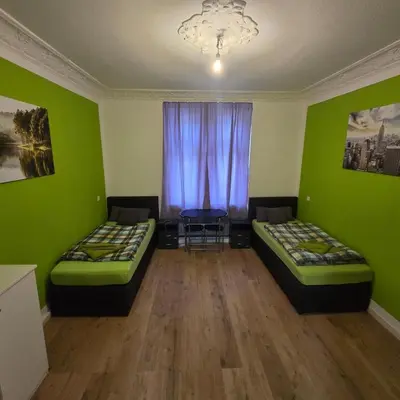 Ein Bett oder Betten in einem Zimmer der Unterkunft Lavalya Zimmervermittlung Wuppertal
