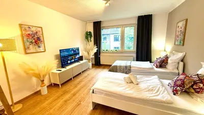 Ein Bett oder Betten in einem Zimmer der Unterkunft Urban Bloom Retreat - Rüttenscheid, Zentrum, Messe