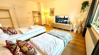 Ein Bett oder Betten in einem Zimmer der Unterkunft Urban Bloom Retreat - Rüttenscheid, Zentrum, Messe