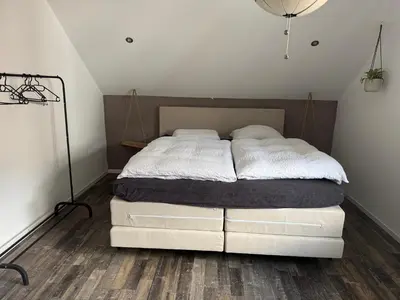 Ein Bett oder Betten in einem Zimmer der Unterkunft Licata Trade fair accommodation - Messezimmer