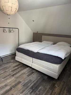 Ein Bett oder Betten in einem Zimmer der Unterkunft Licata Trade fair accommodation - Messezimmer