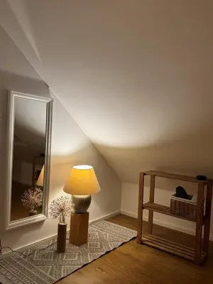 Ein Bett oder Betten in einem Zimmer der Unterkunft Ruheoase unterm Dach