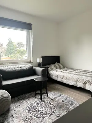 Ein Bett oder Betten in einem Zimmer der Unterkunft Messe Apartment - Near Trade Fair Grounds
